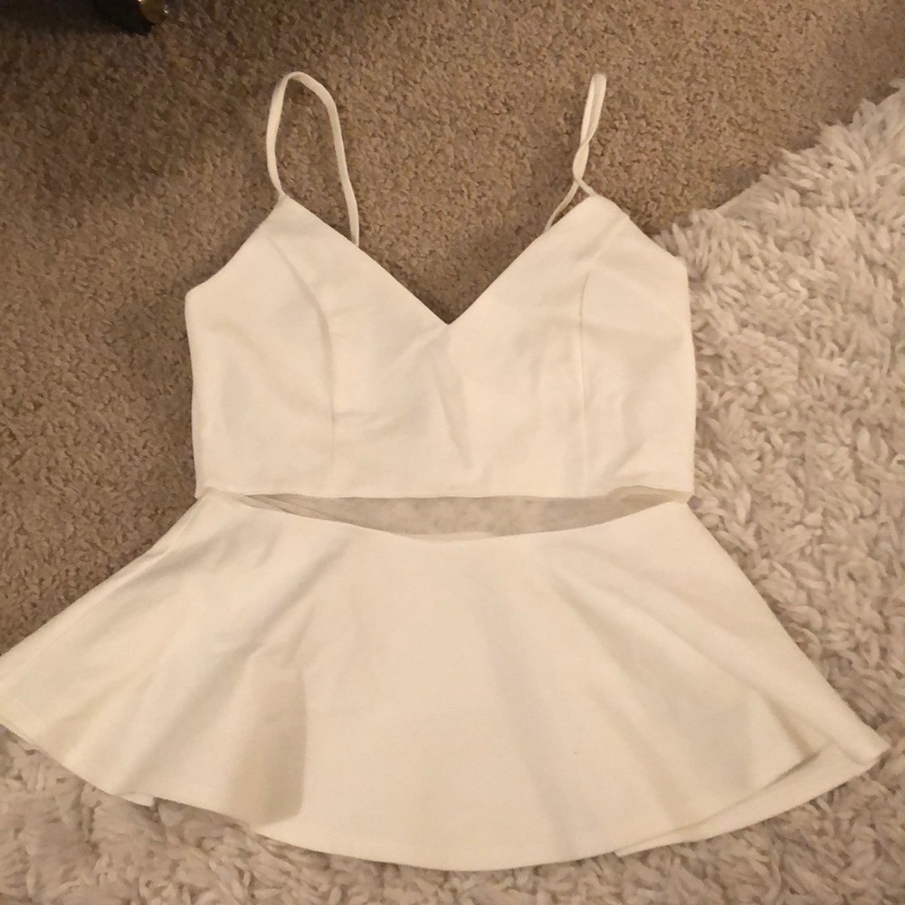 Peplum top with sheer mesh strip detail